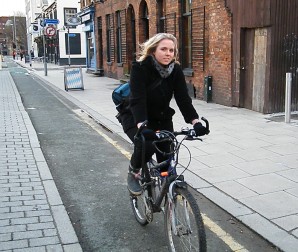 Anne Berg riding in cycle lane in Manchester